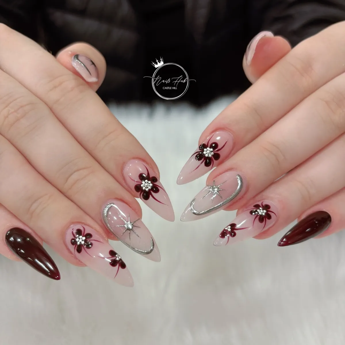 Sheer nude base with dark florals and silver star accents