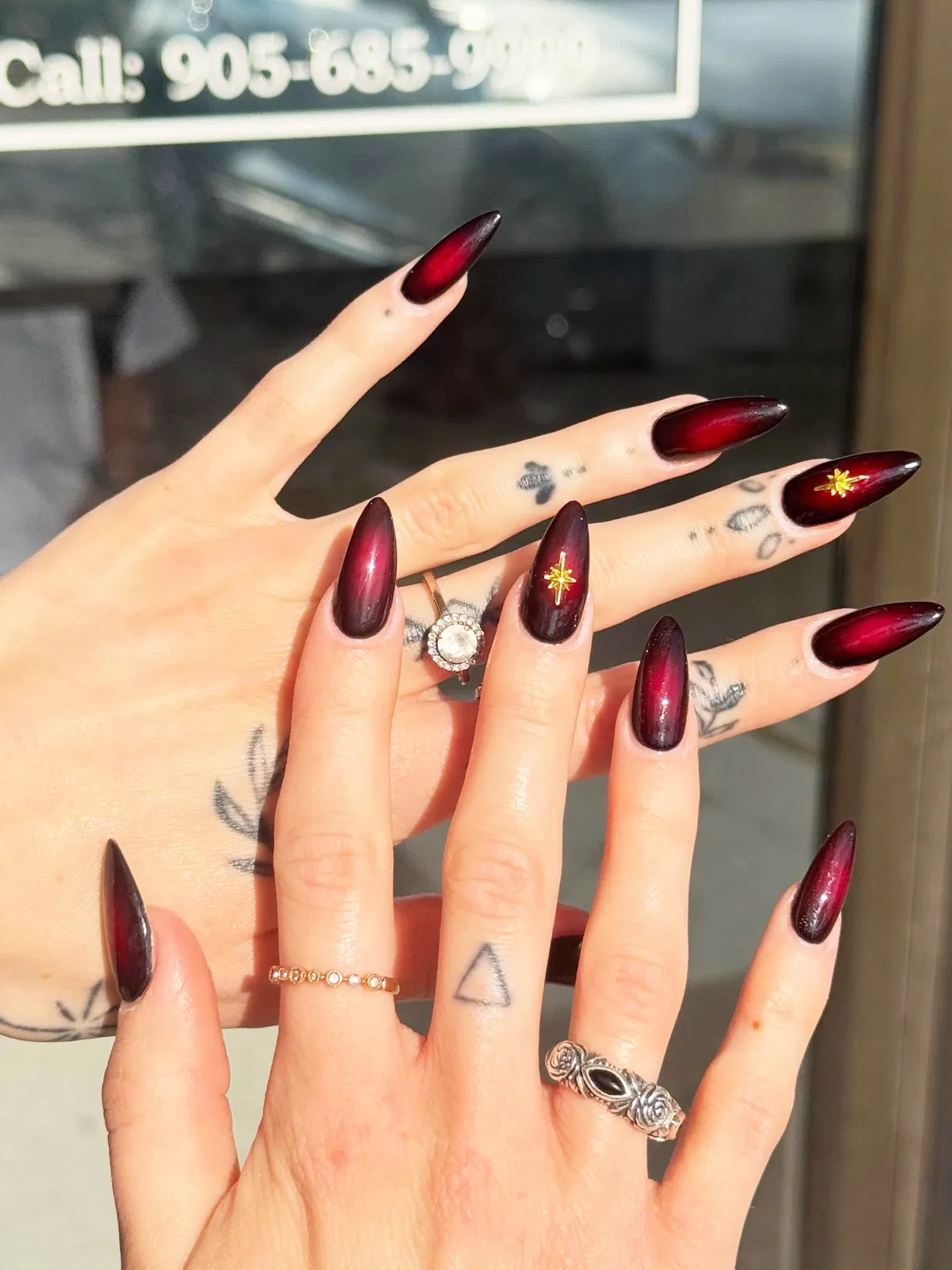 Stiletto cherry gradient with gold starburst accents