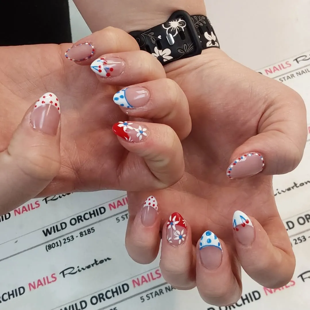 Dotted outlines and polka-dot French tips with floral accent