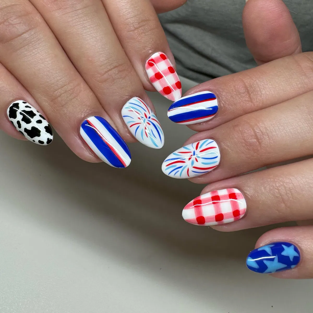 Firework bursts paired with stripes, gingham, and cow print