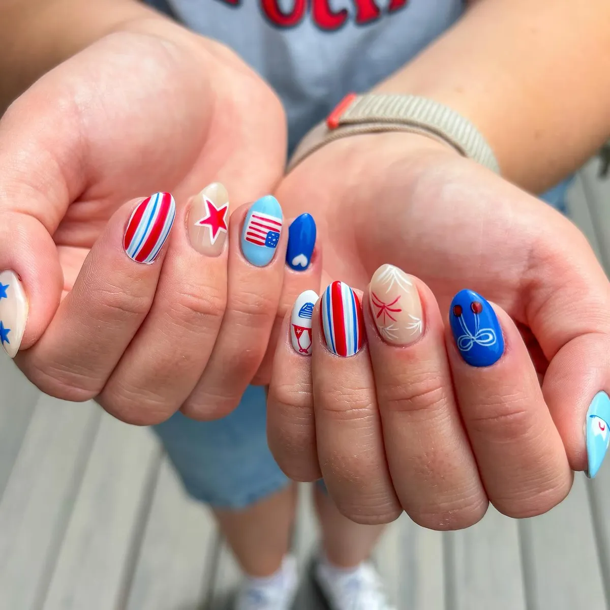 Graphic mix: stripes, stars, a small heart, and bow-like line art