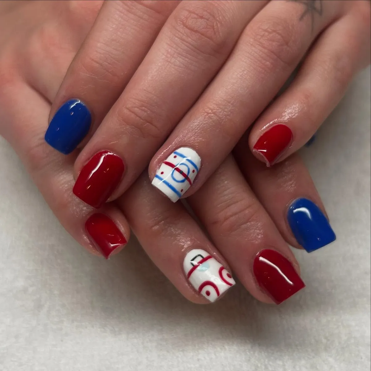 Solid red/blue with graphic line-and-circle accents