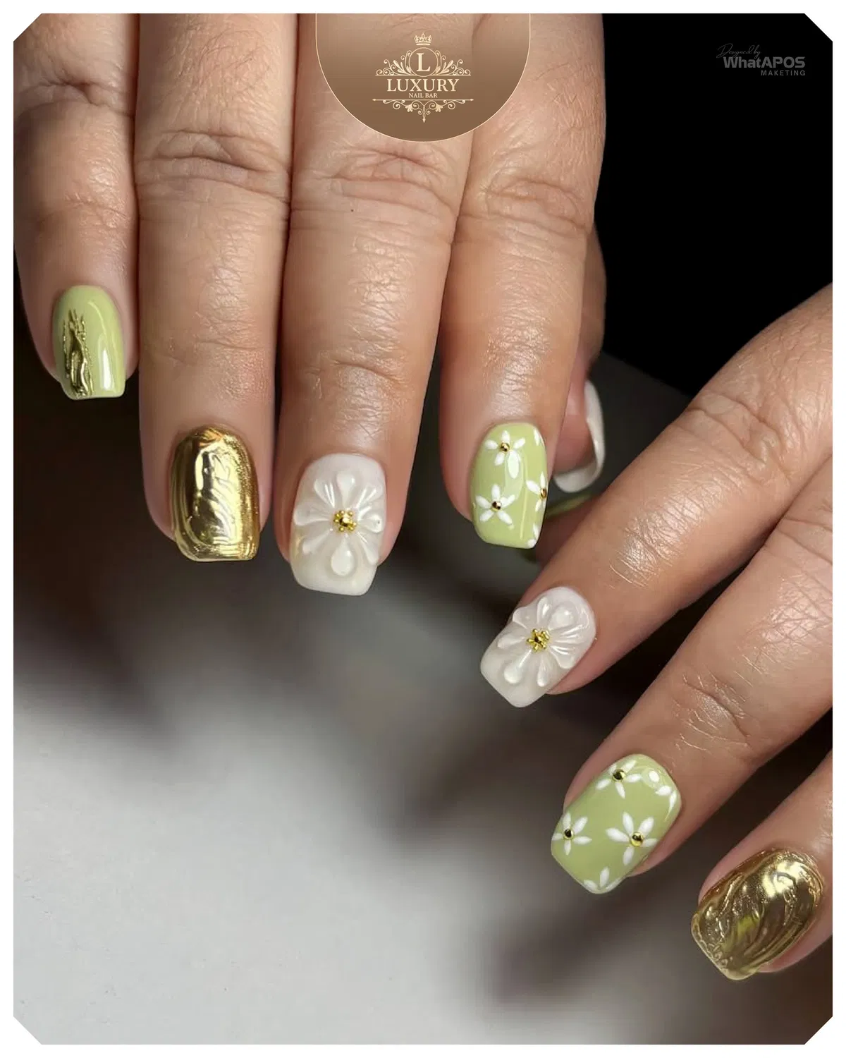 Short square mix: pale green, white florals, and gold accent nails