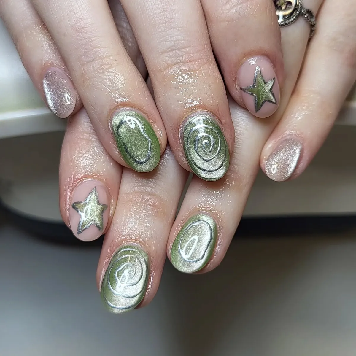 Metallic olive swirls with star accents