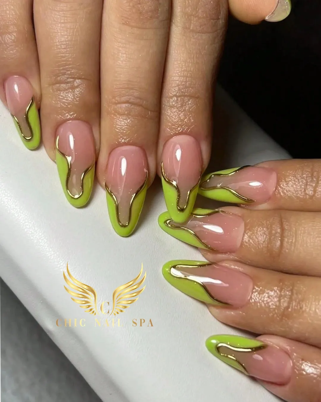 Nude pink with lime-green drips and gold outlining