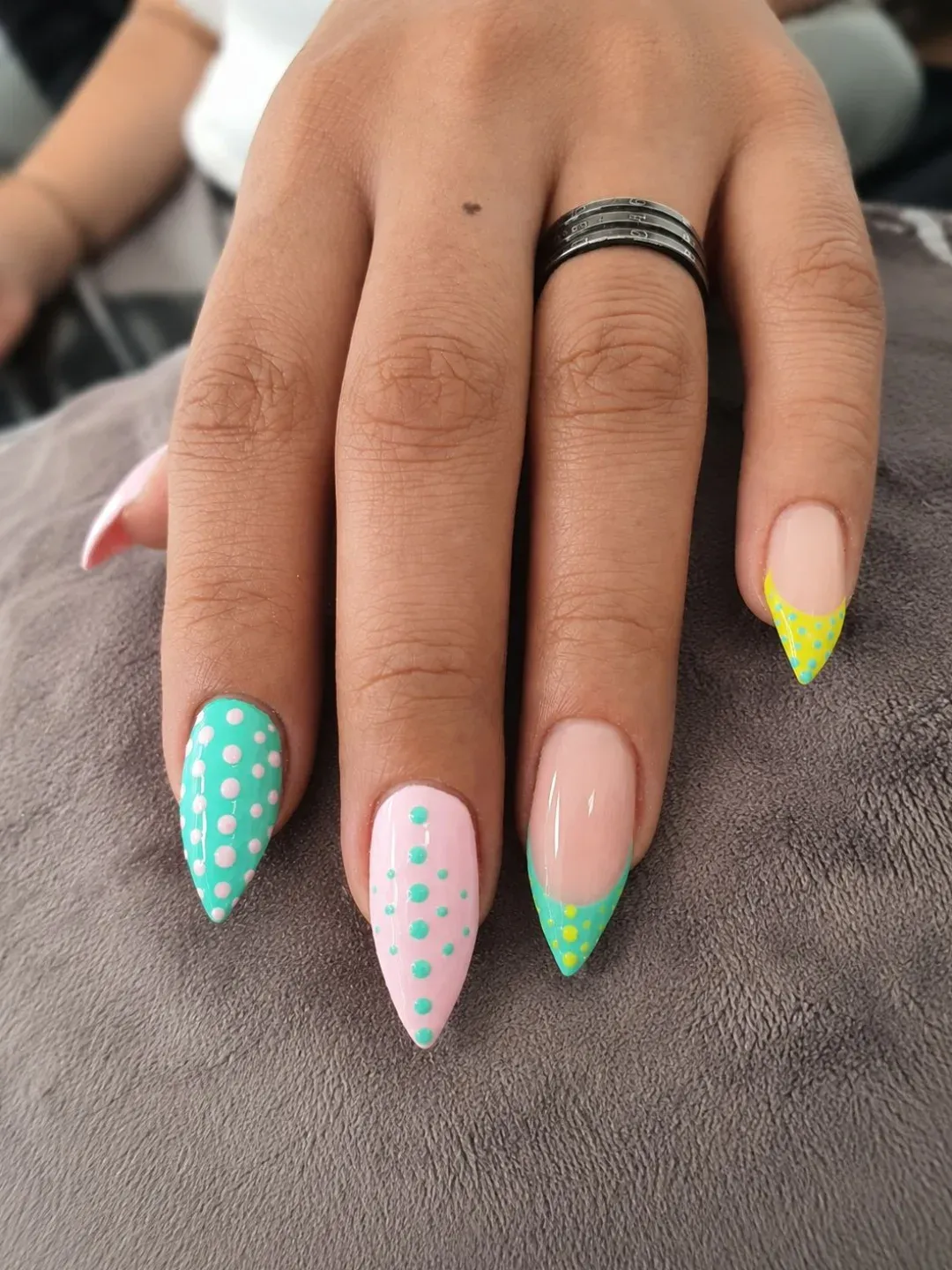 Stiletto tips with mixed green/yellow and turquoise dots