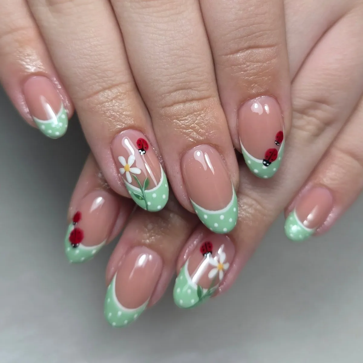 Mint polka-dot French tips with ladybugs and floral art