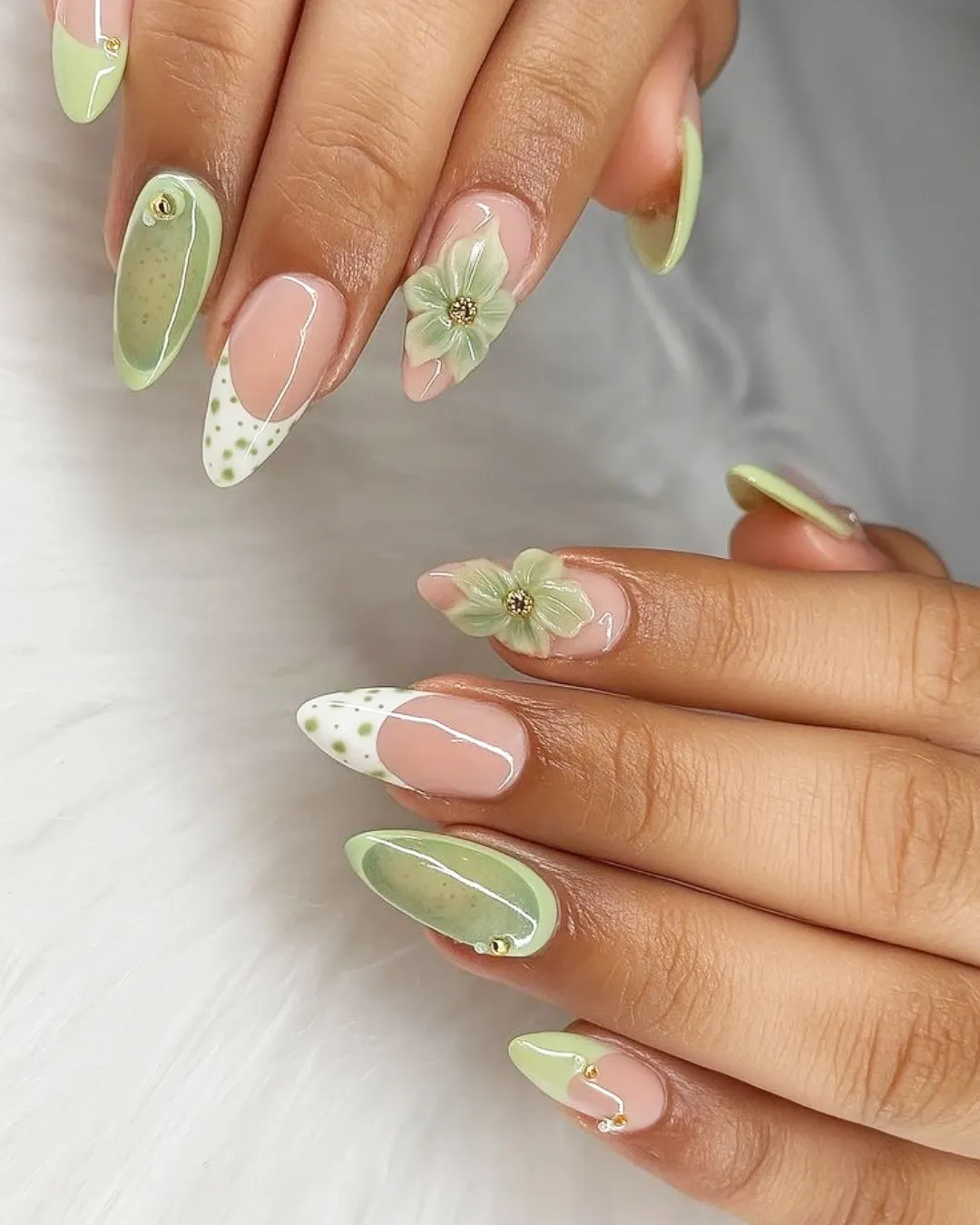 Soft green polka-dot tips with 3D-style floral accents