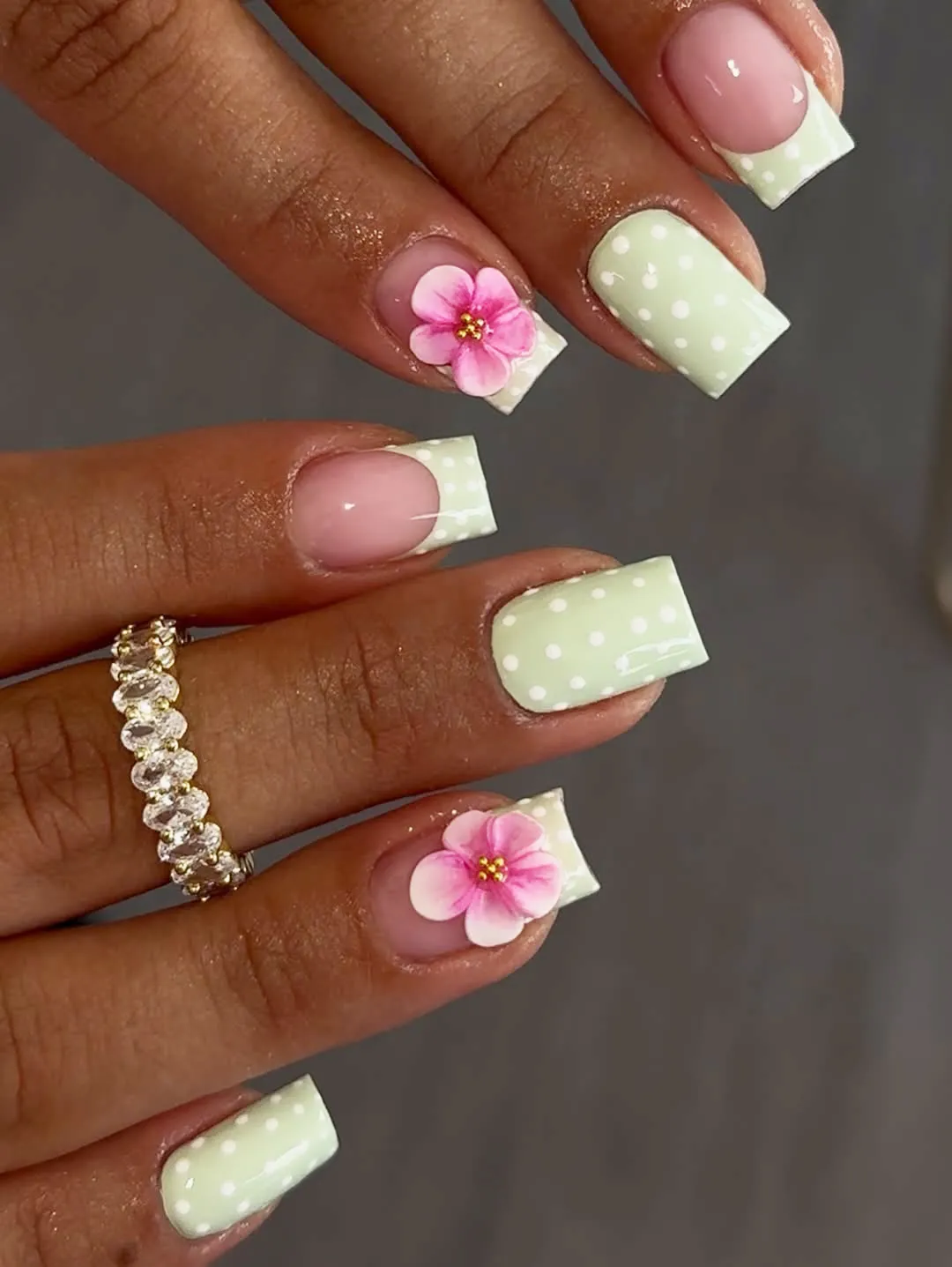 Mint polka-dot French tips with floral accents