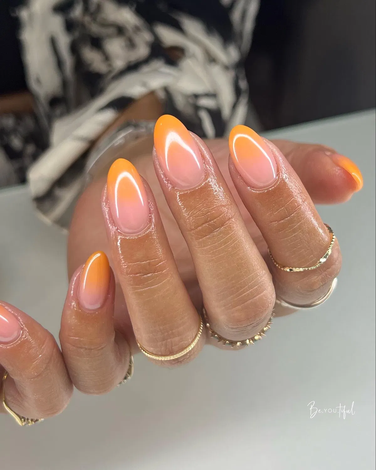 Soft orange glow on a sheer pink base
