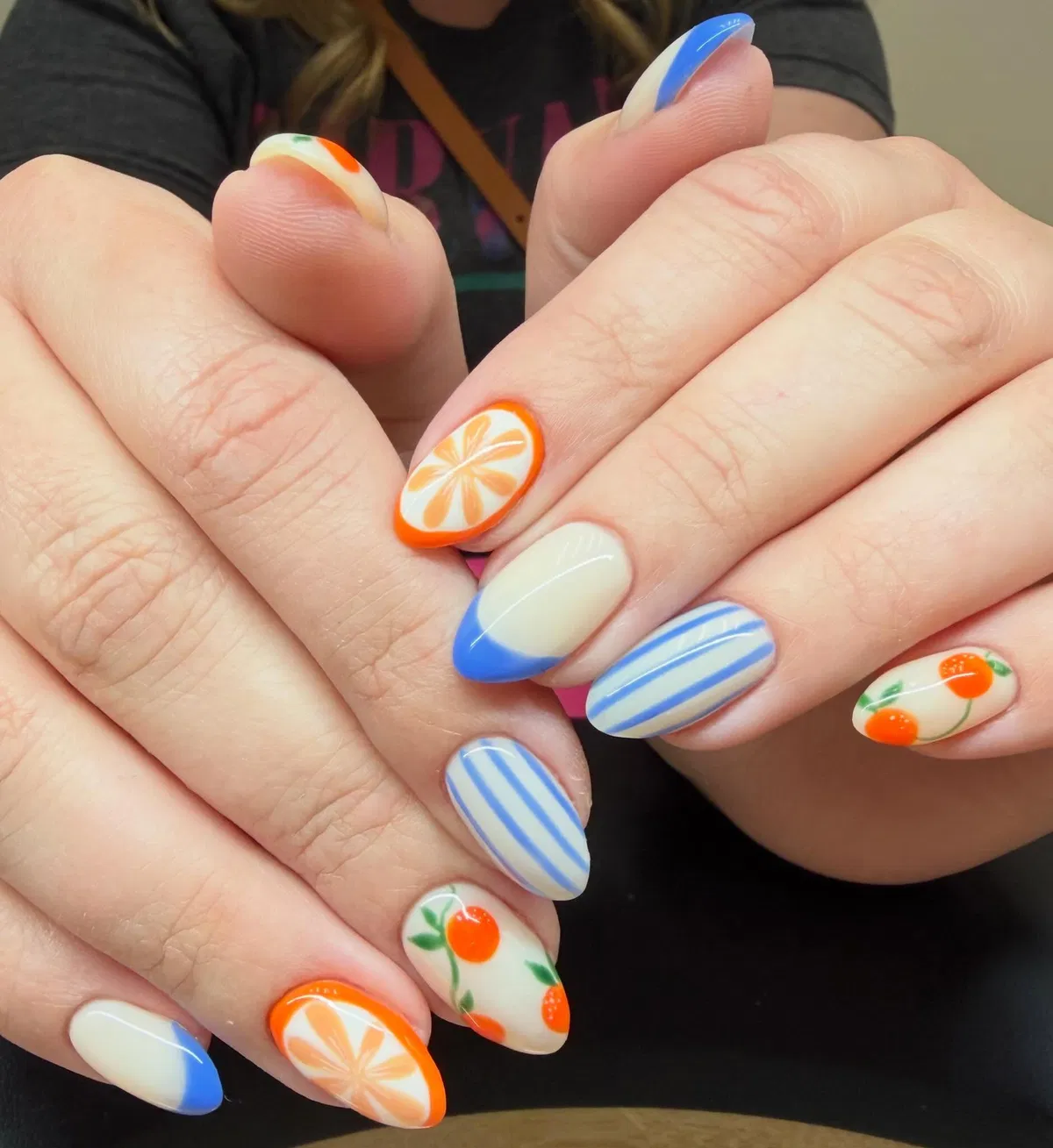 Blue tips and stripes with orange citrus fruit accents