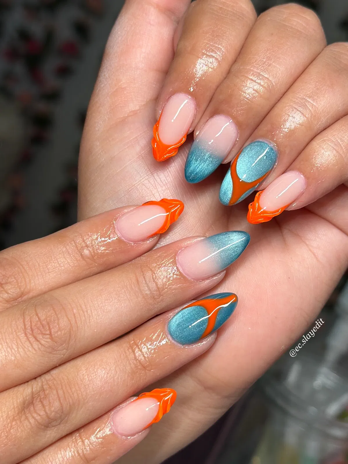 Nude base with orange 3D tips and teal-blue accents