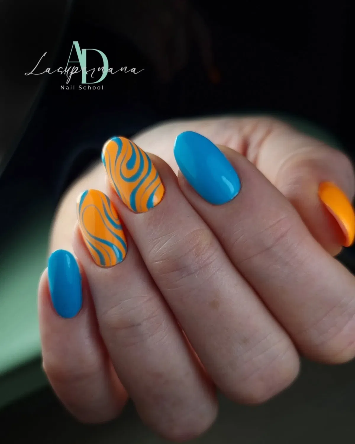 Turquoise solids with orange-and-blue swirl pattern