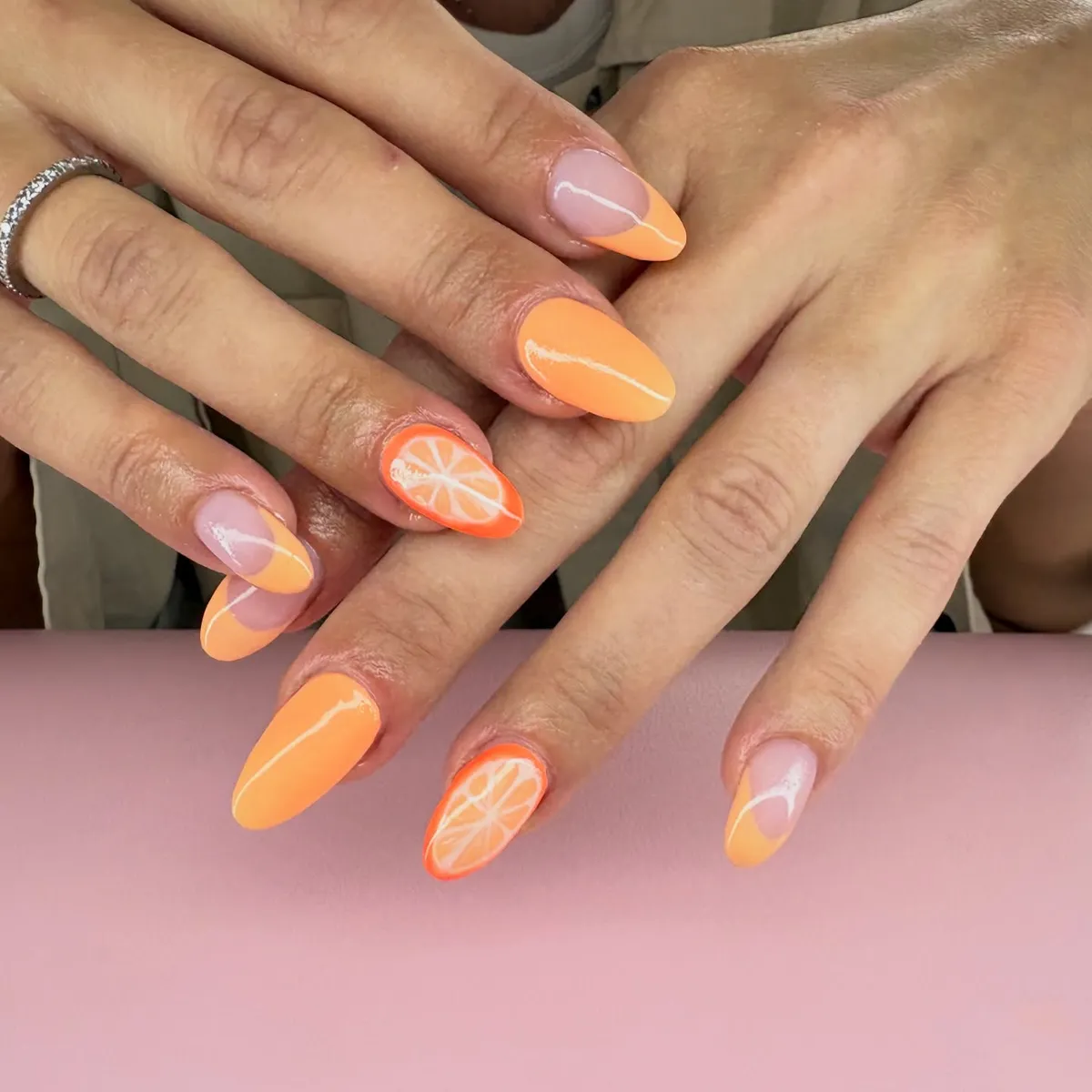 Orange French tips with citrus slice accents