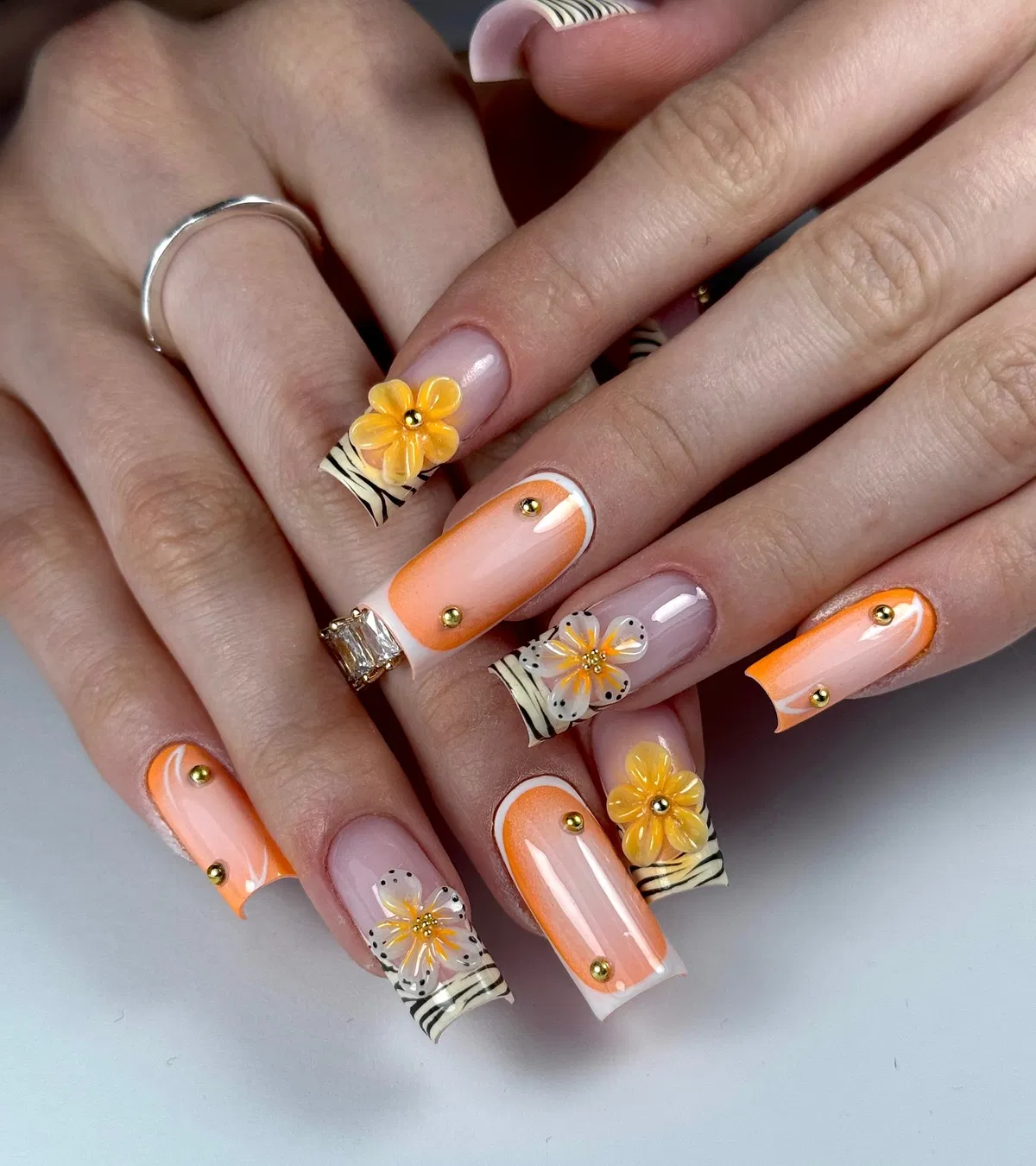 Peach-orange gradients with zebra tips and 3D flowers