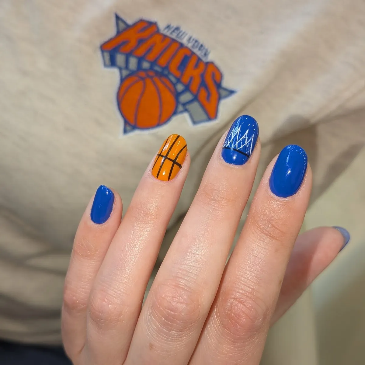 Royal blue set with orange basketball-line accent