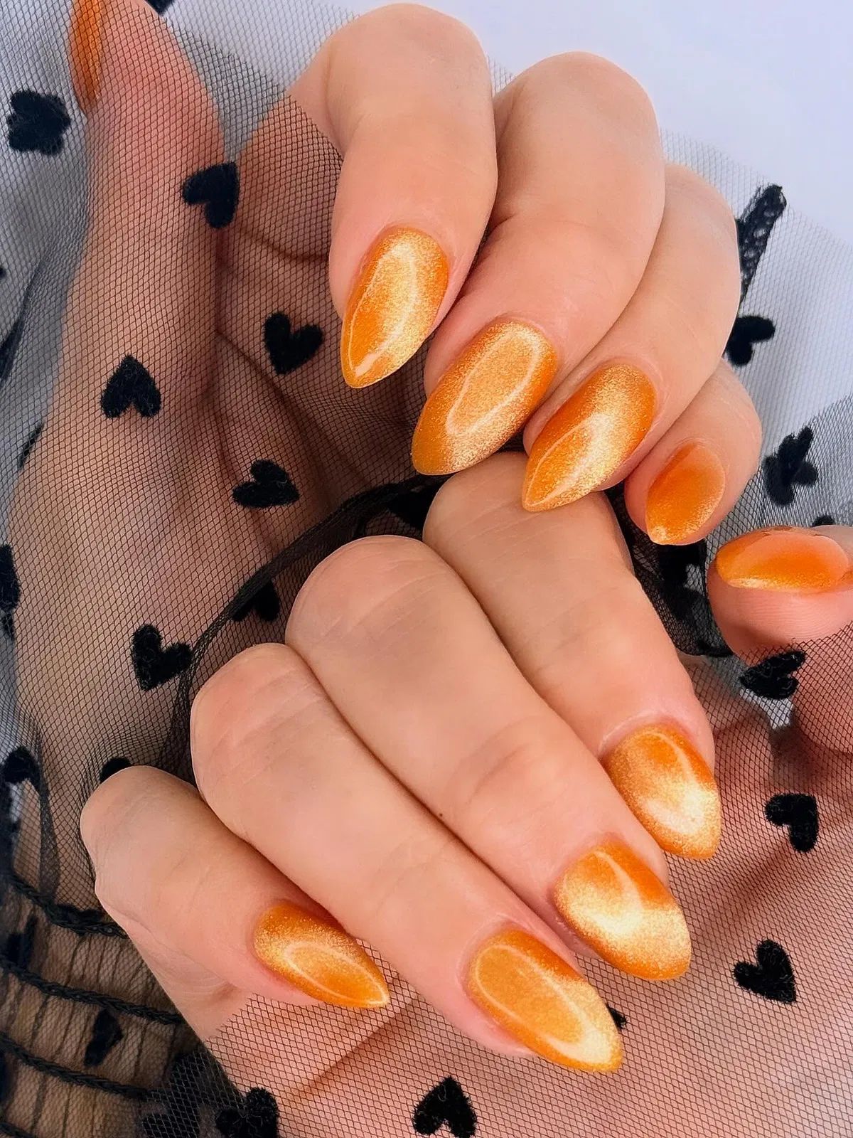 Shimmery Orange Almond Nails
