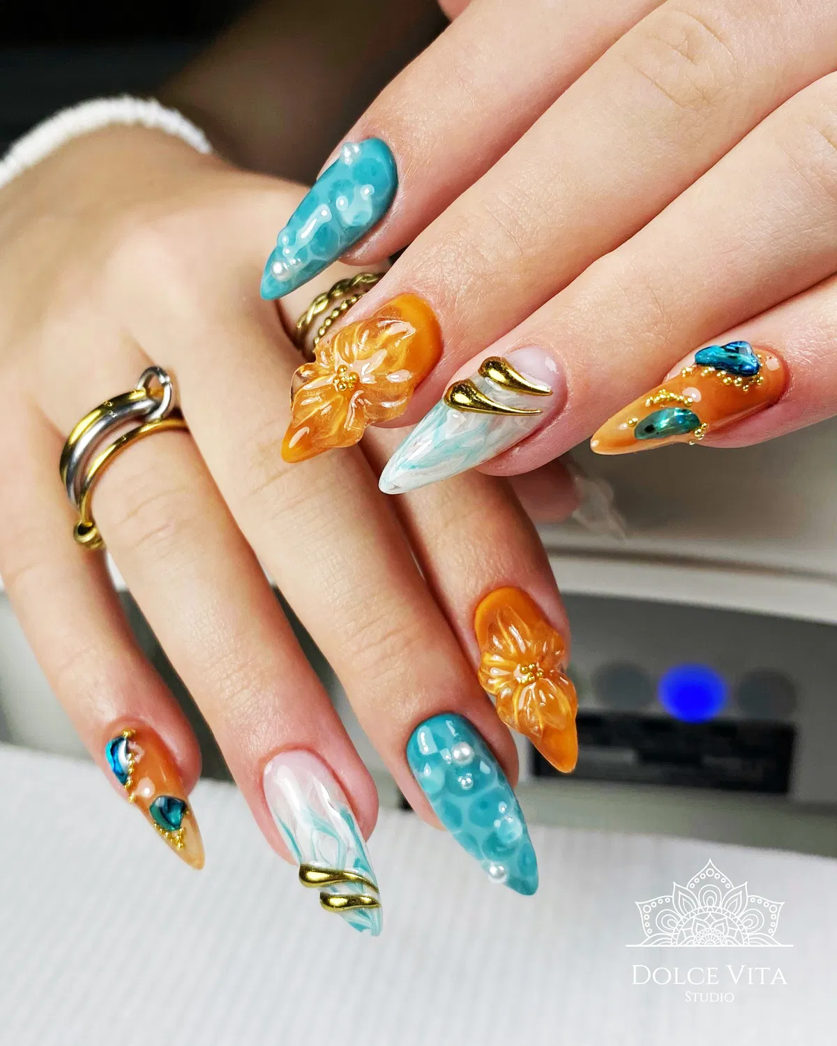 3D orange florals with turquoise texture and gold accents