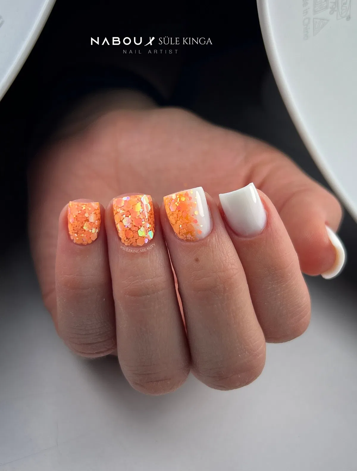 Chunky orange glitter with crisp white contrast