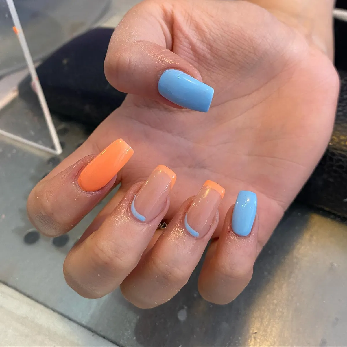 Light blue solids with peach French tips and cuticle-line detail