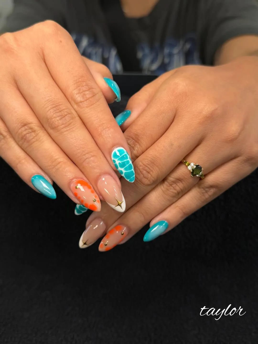 Teal and orange dot accents with white tips and gold star detail