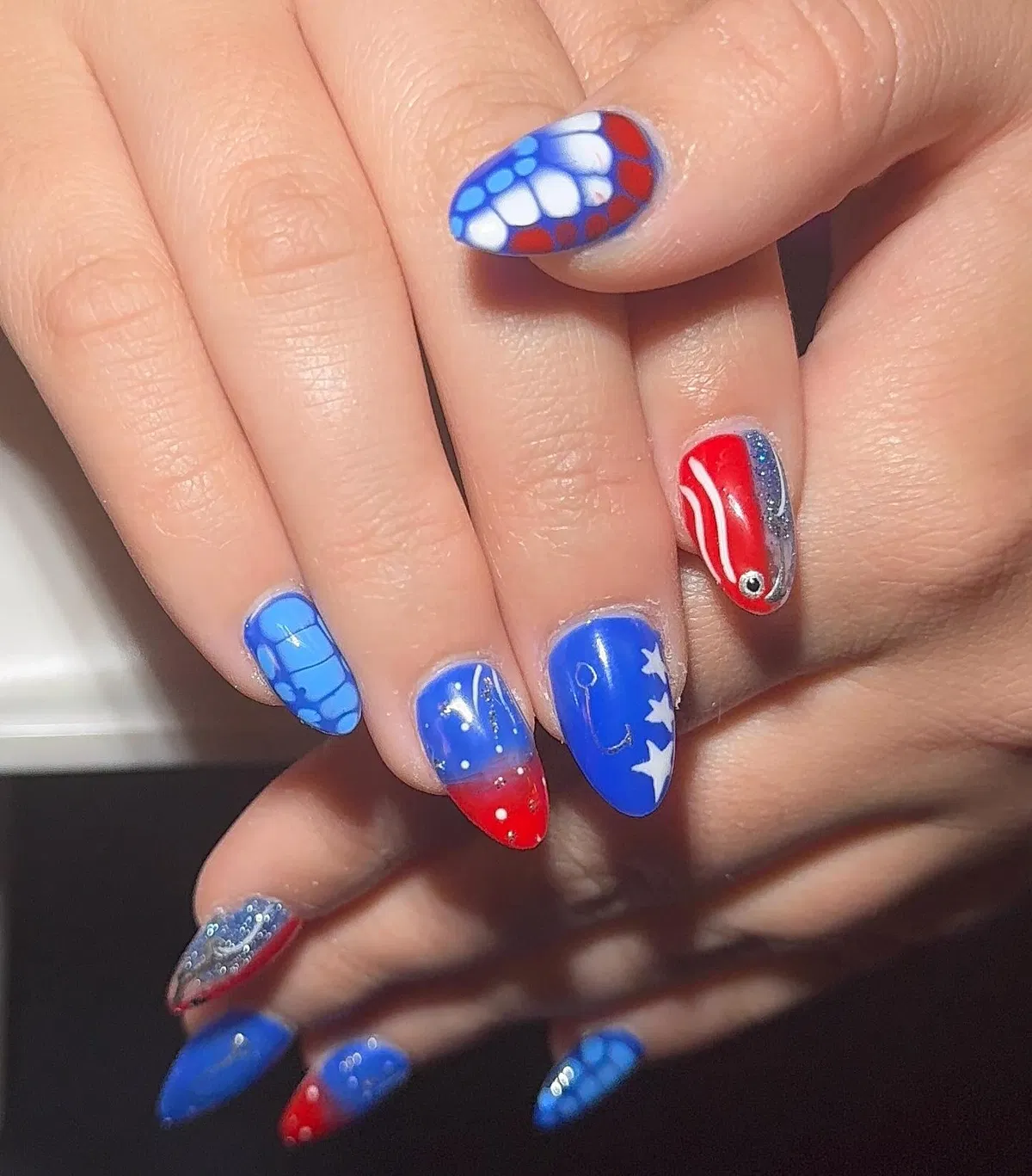 Color-blocked red/white/blue with stars and a metallic stud accent