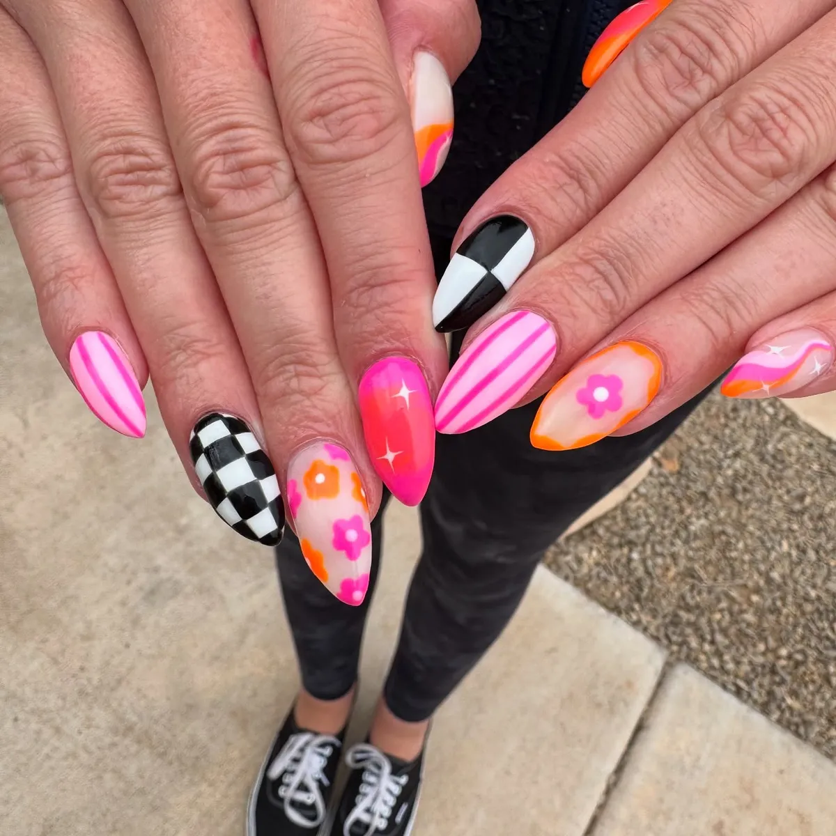 Bold mix: checkerboard, pink stripes, and bright floral accents