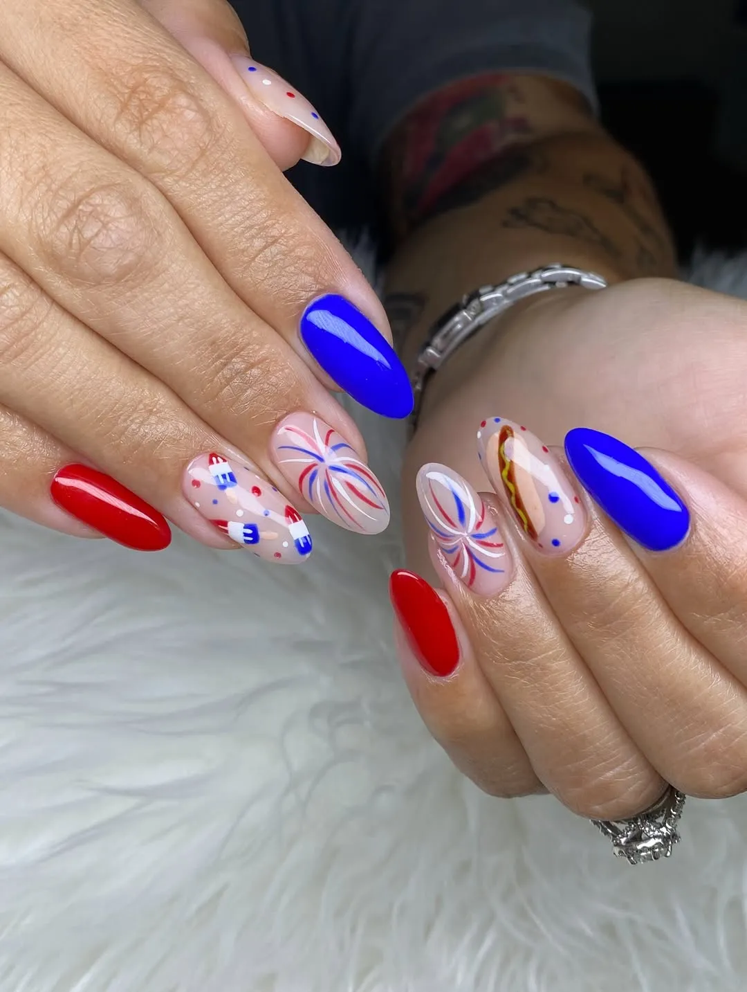 Bold red and blue with swirl bursts and a hotdog accent