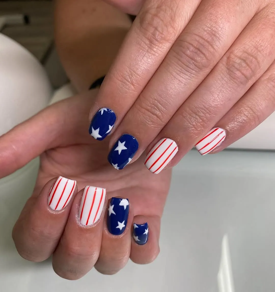Alternating blue-star and red-stripe nails