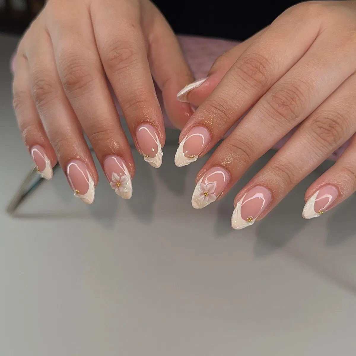 Classic French Tips with Tiny Beads and a Subtle Flower Accent