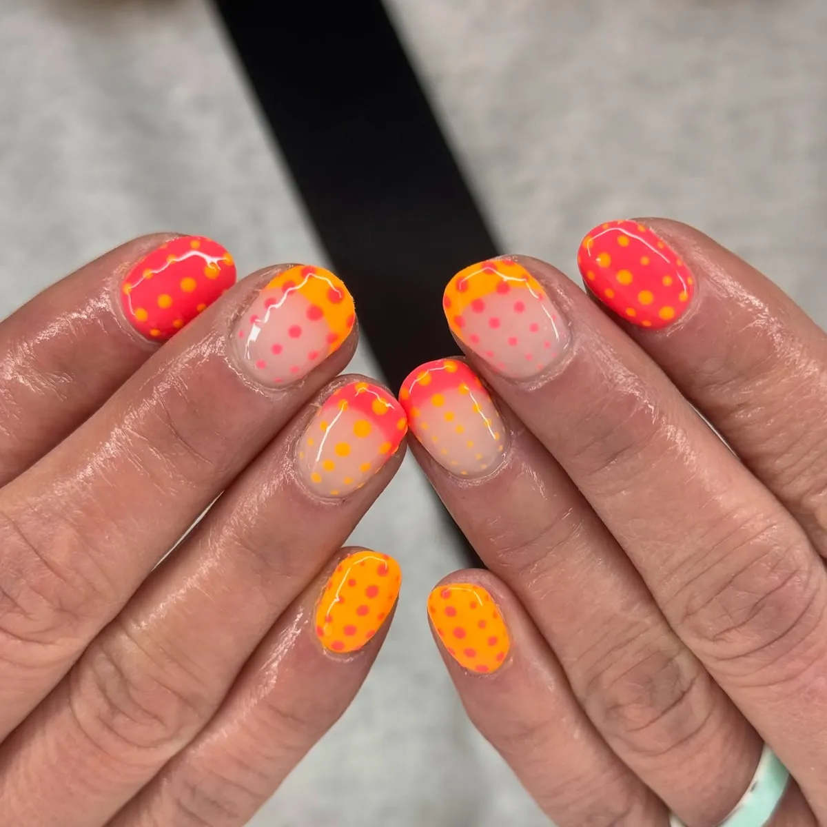 Neon pink-orange polka dots with white squiggles