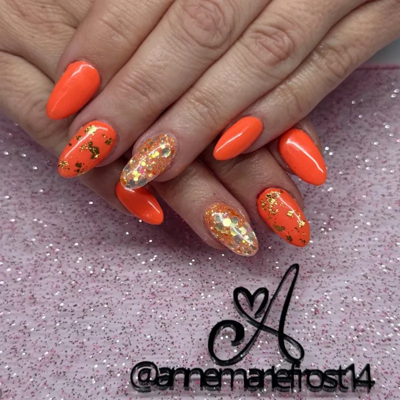 Glossy orange with glitter and gold-foil style accents