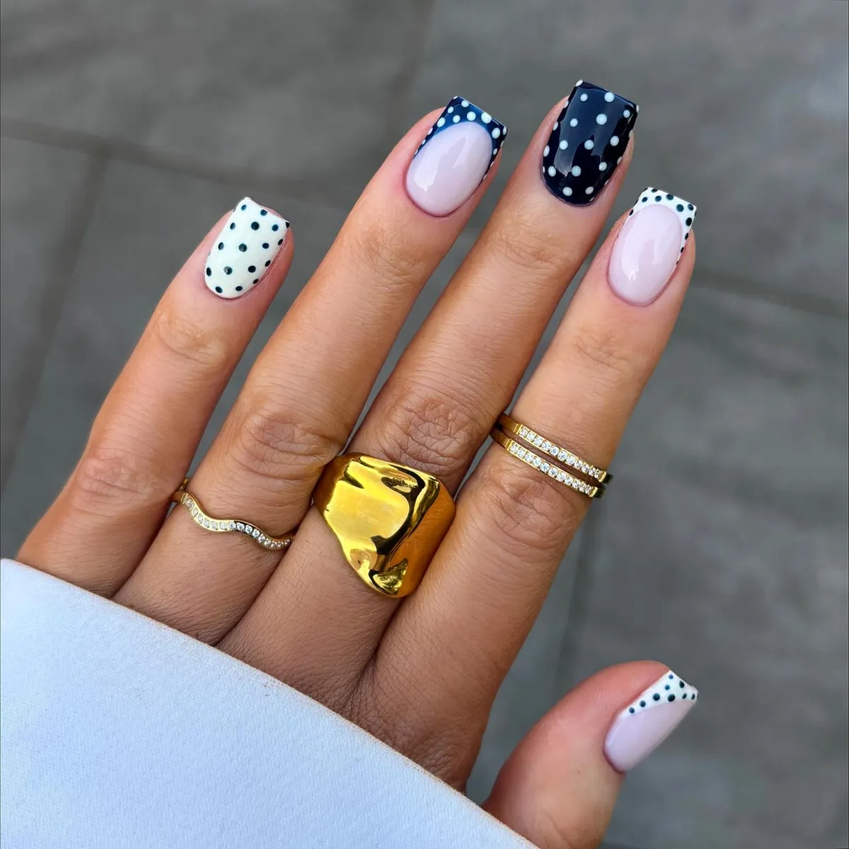 Mixed French tips with navy and white polka dots