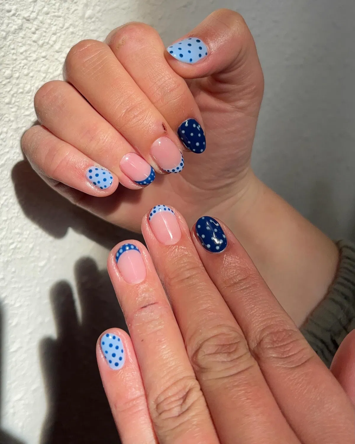 Short blue polka dots with dotted French tips
