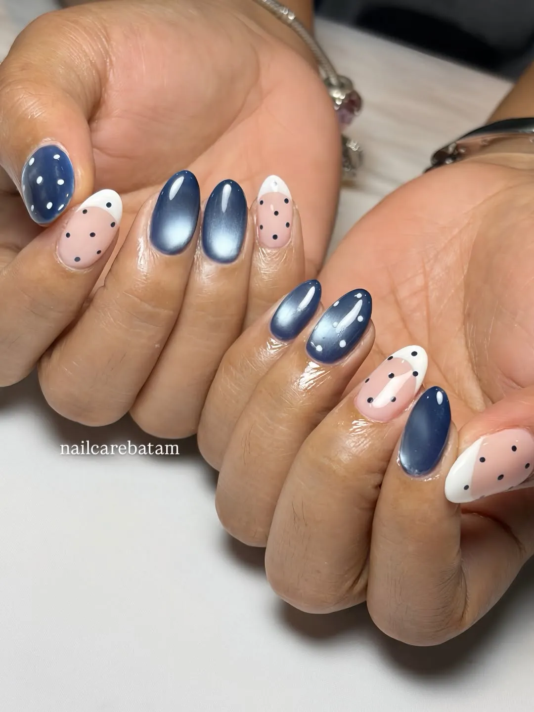 Navy solids mixed with black polka-dot French tips