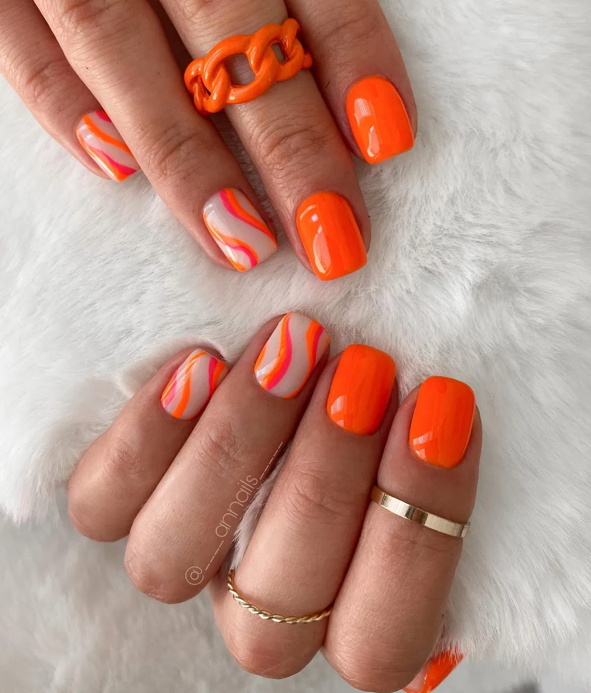 Glossy neon orange with wavy striped accent nails