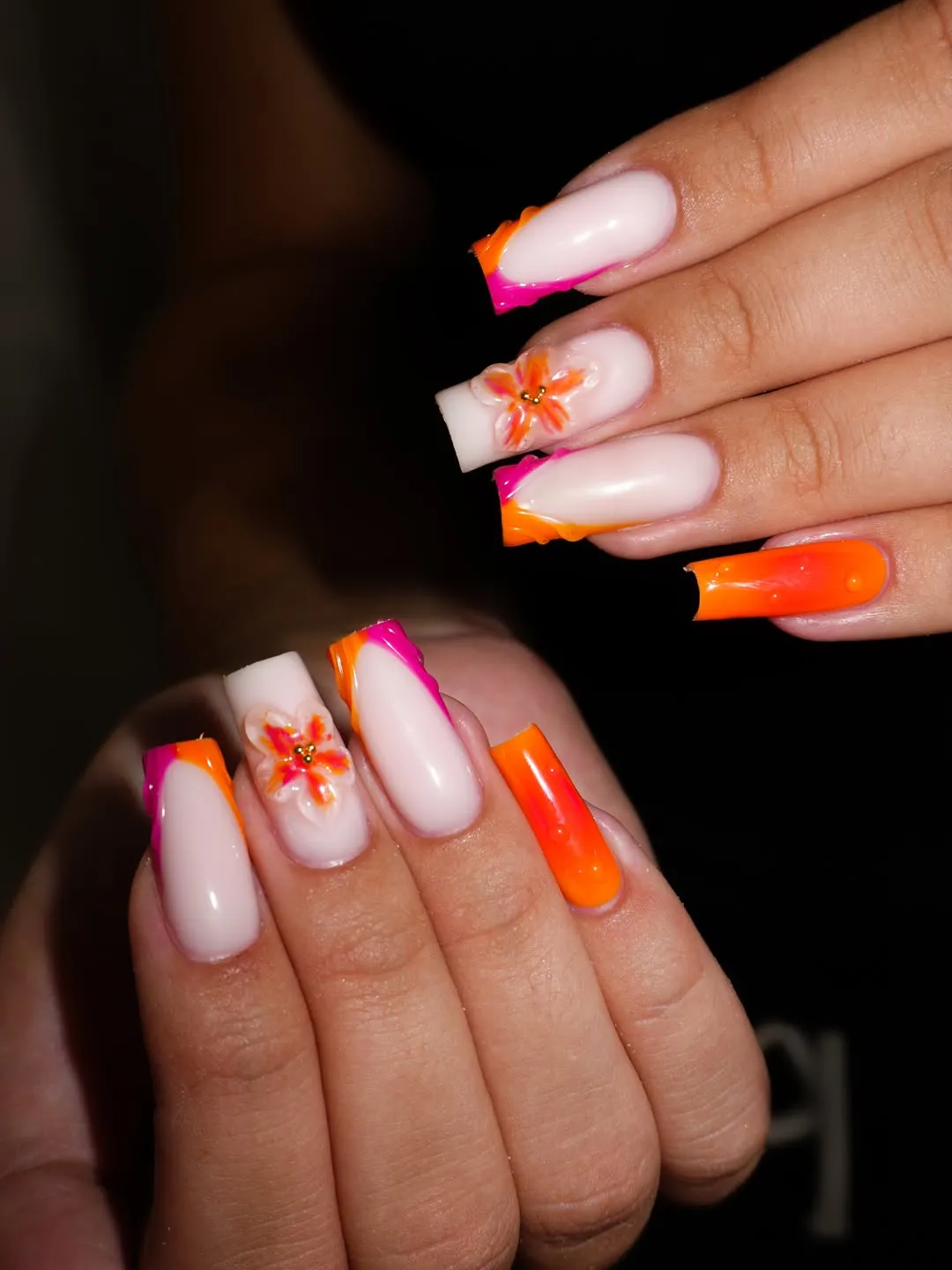 Coffin nails with neon French tips and 3D floral accents
