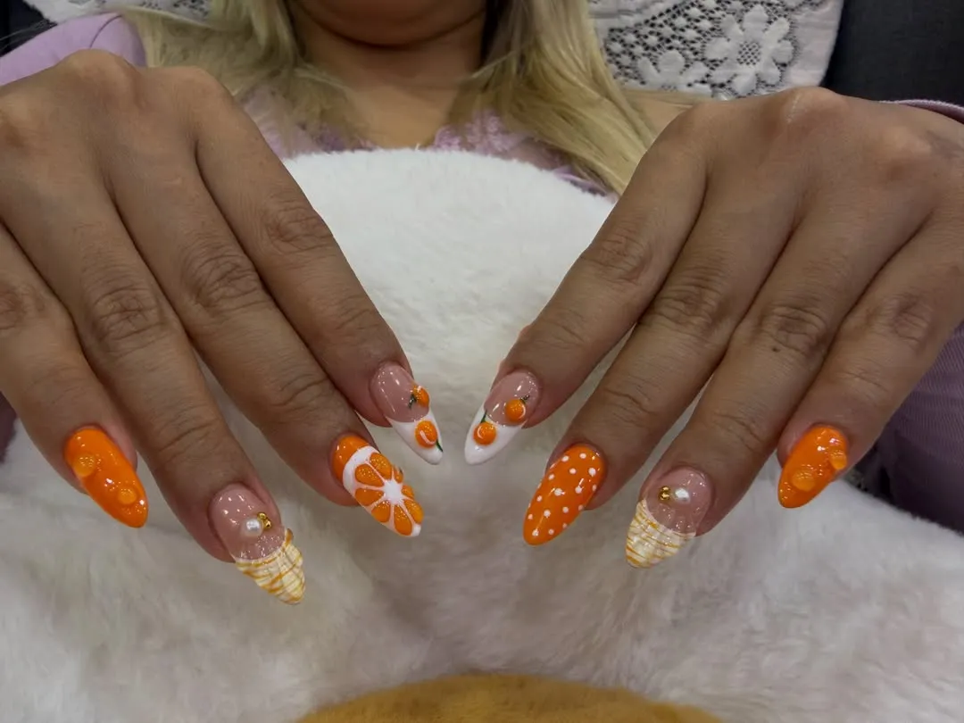 Citrus-inspired orange set with polka dots and striped tips