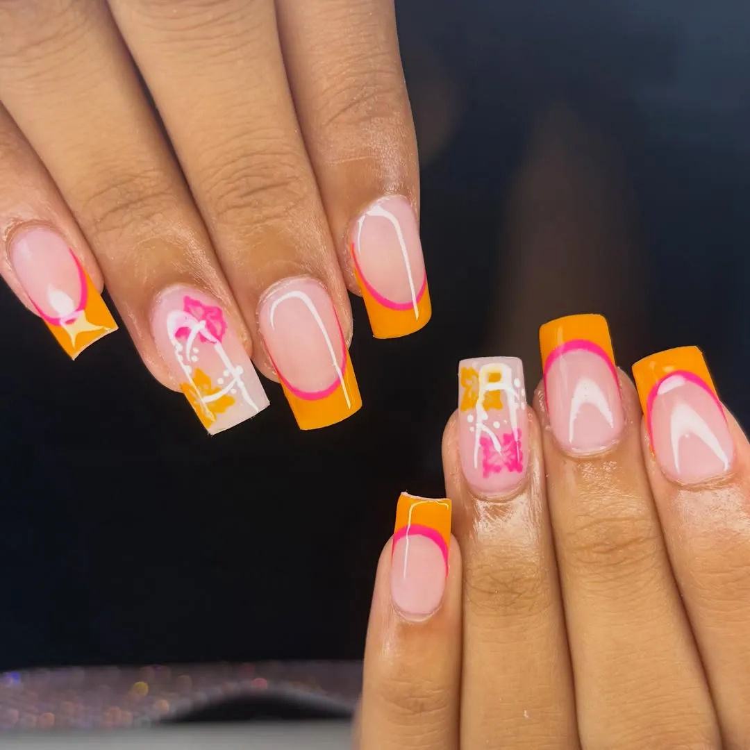 Orange French tips with hot-pink outline and floral accents