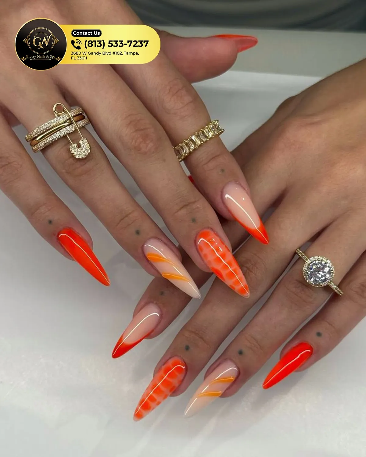 Pointed orange tips and solids with diagonal lines and spotted accent