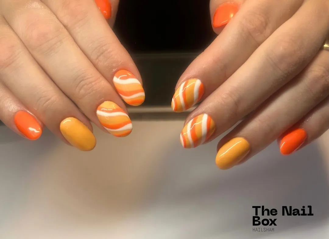 Short glossy set with orange solids and wavy orange-white stripes
