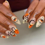 π€ 17+ Orange and Black Nails π§‘That Turn Every Look Into a Bold Statement Fashion image by @dailynailtrends