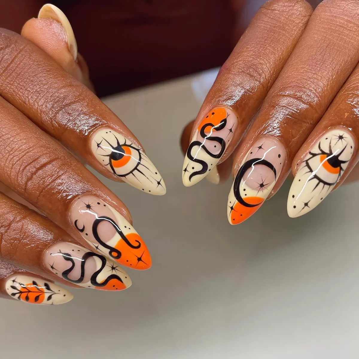 Cream base with black line art and orange blocks