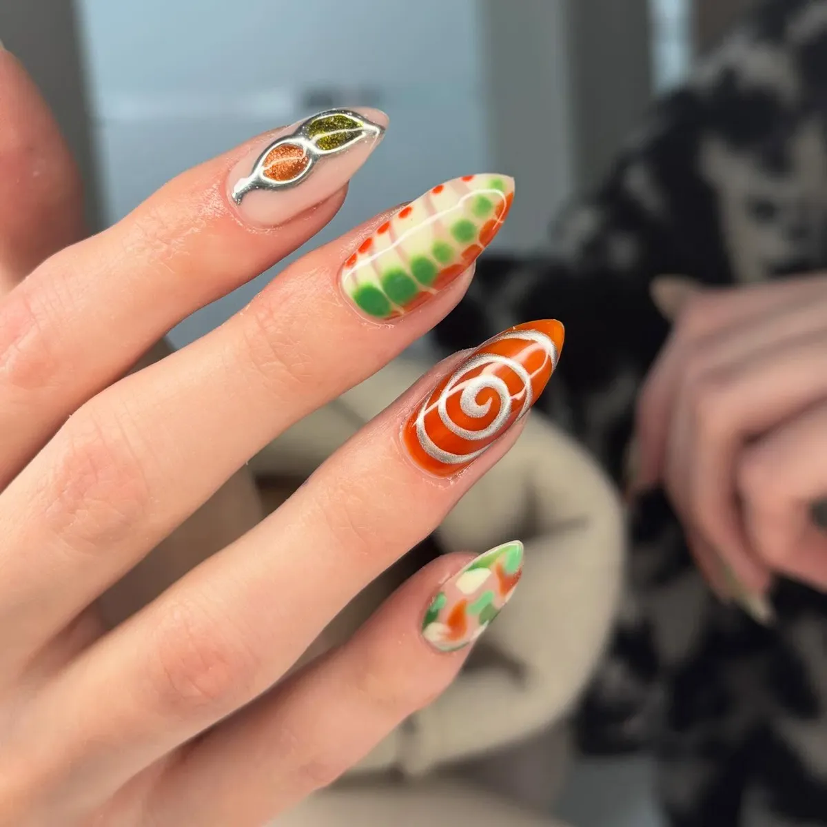 Mixed orange-green patterns with metallic accent
