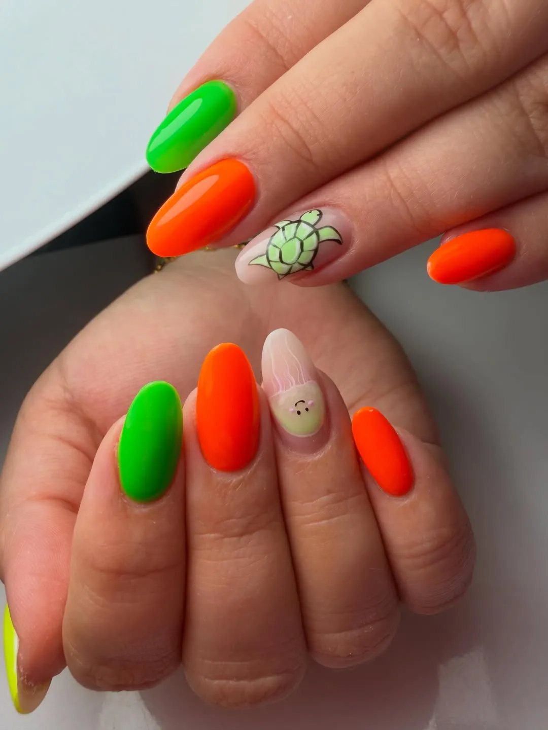 Bright orange and green with character-style accent art