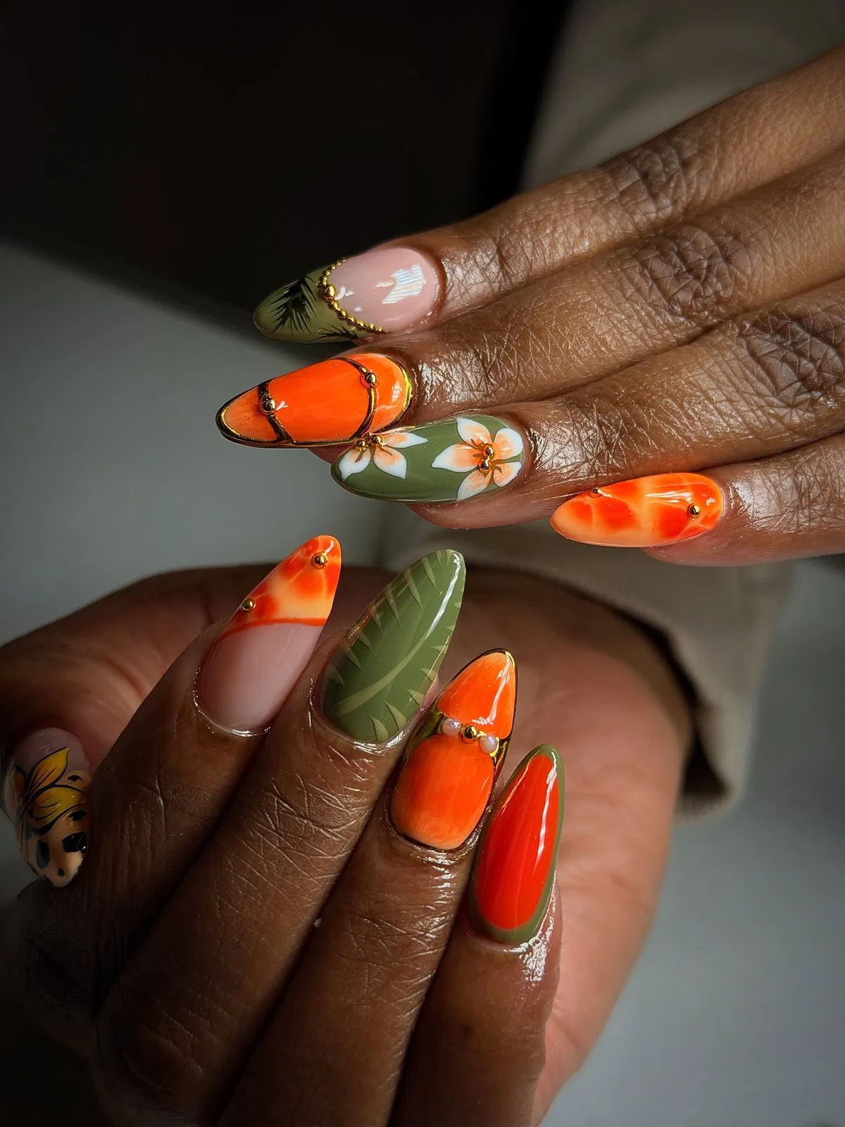 Olive-and-orange florals with gold bead accents