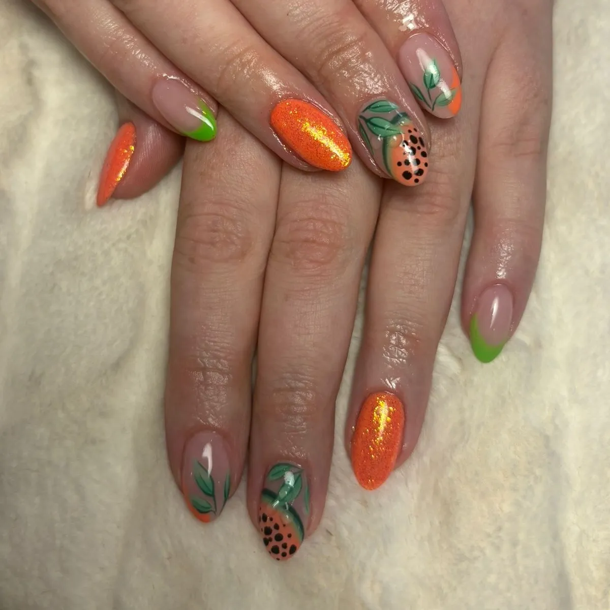 Shimmery orange with leafy green accents and black dots