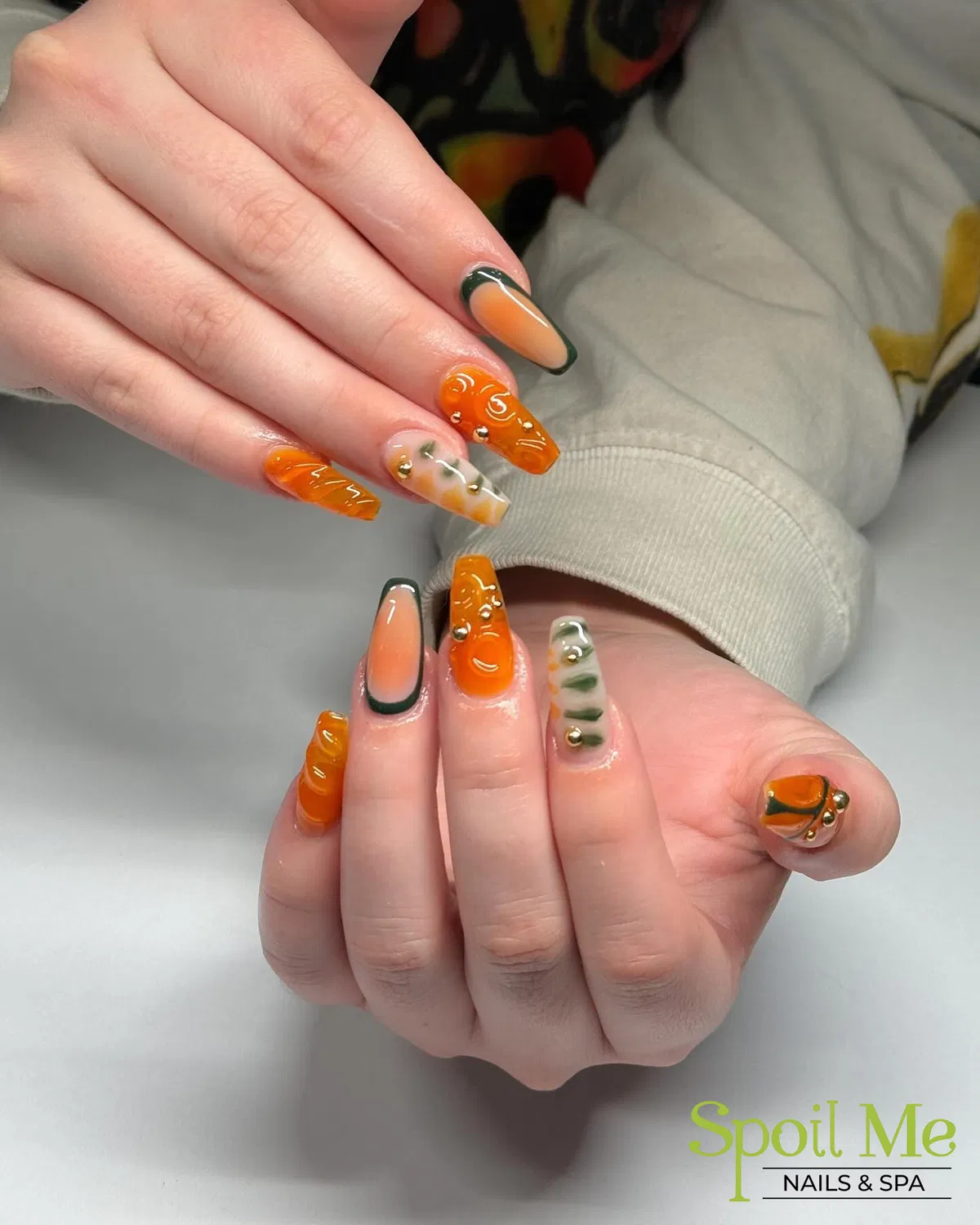 3D orange swirls with green-outlined and marbled accents