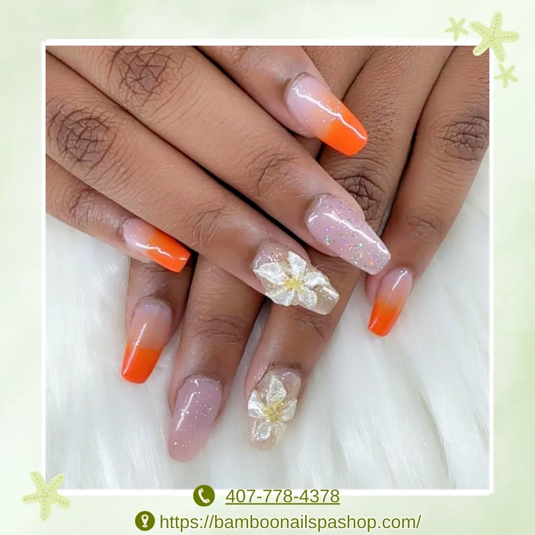 Orange ombrΓ© tips with 3D white flowers