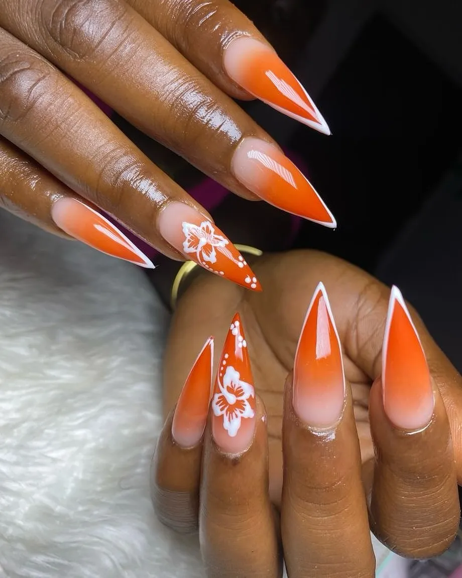 Orange ombrΓ© stilettos with white florals